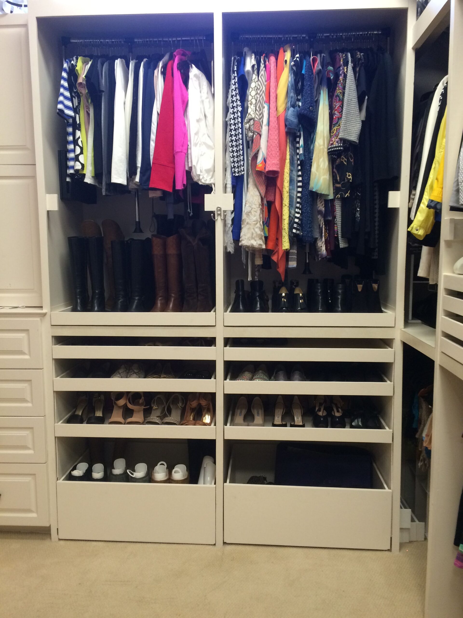 Organized closet with open drawers Organized closet with open drawers